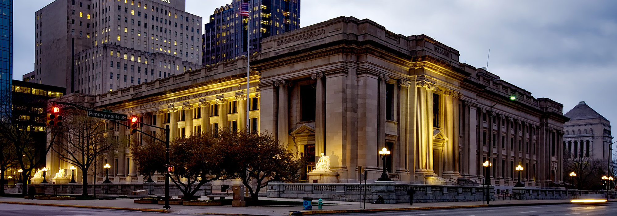 Birch Bayh Federal Building warmly lit at dusk in Indianapolis, Indiana