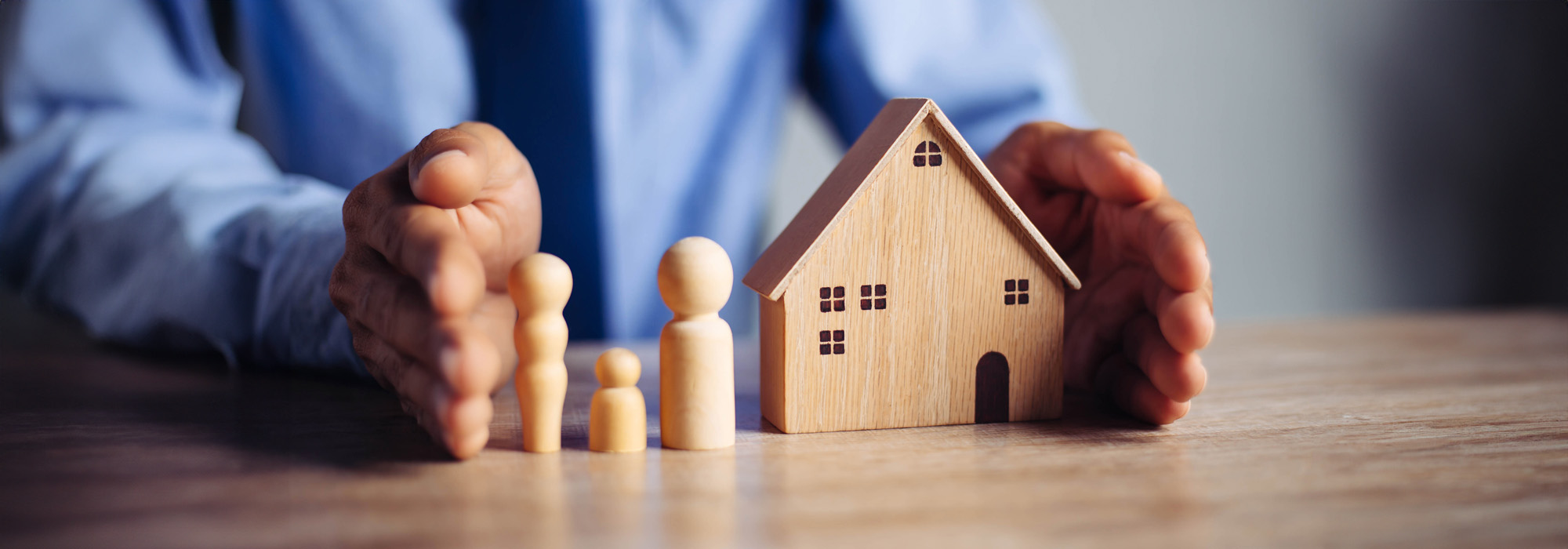 insurance agent presents the hands protection model that symbolize the coverage