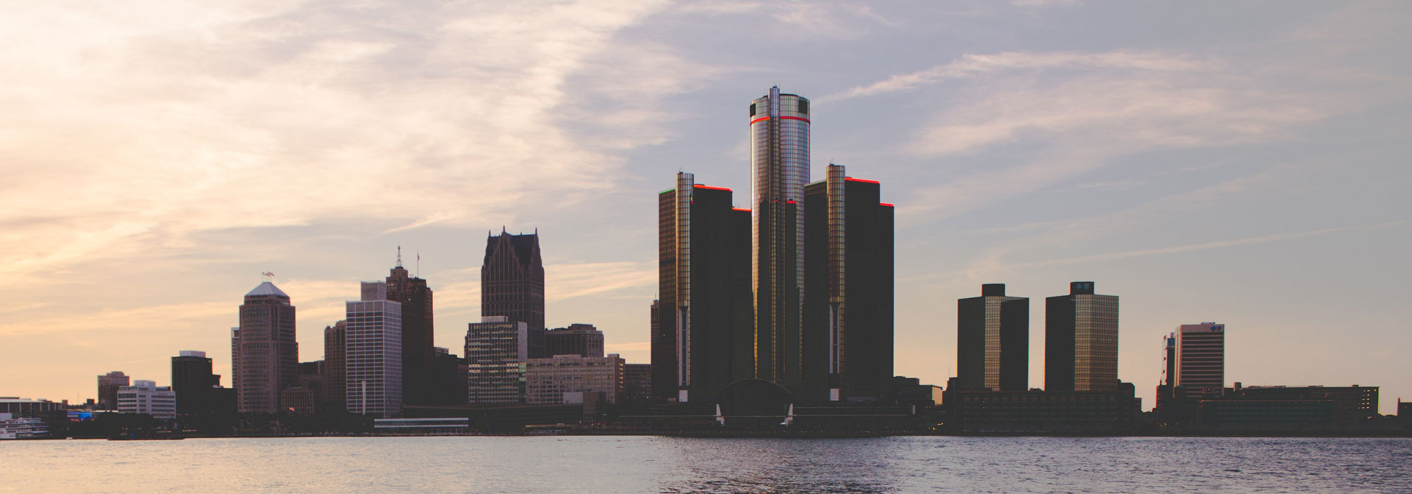 Detroit, Michigan skyline at sunset seen from the Detroit river