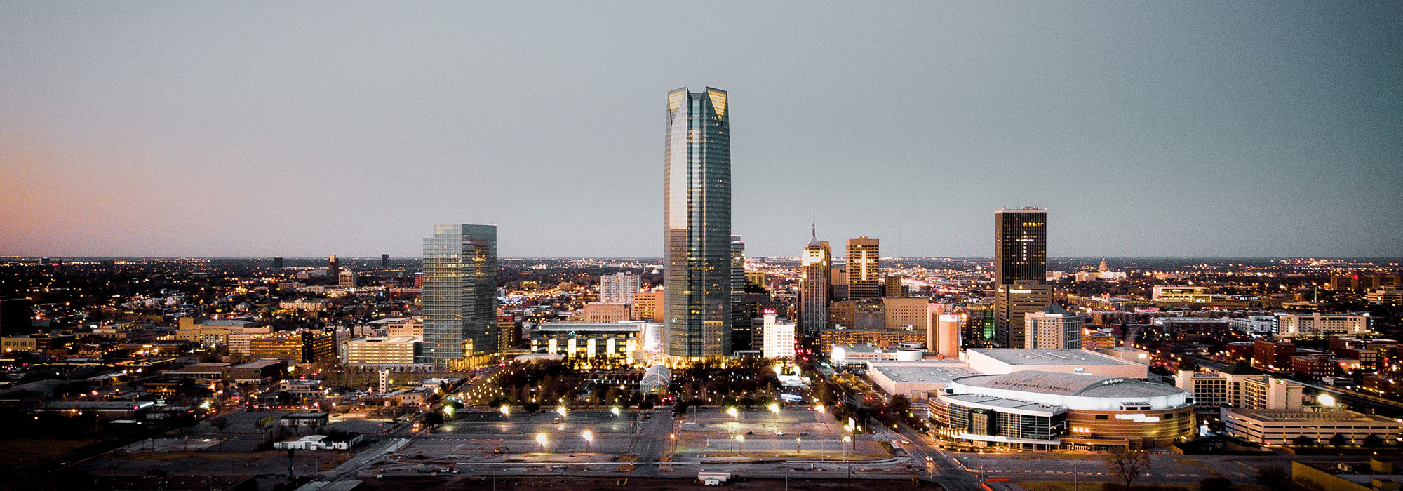 Devon Tower standing high above the Oklahoma City skyline at sunset