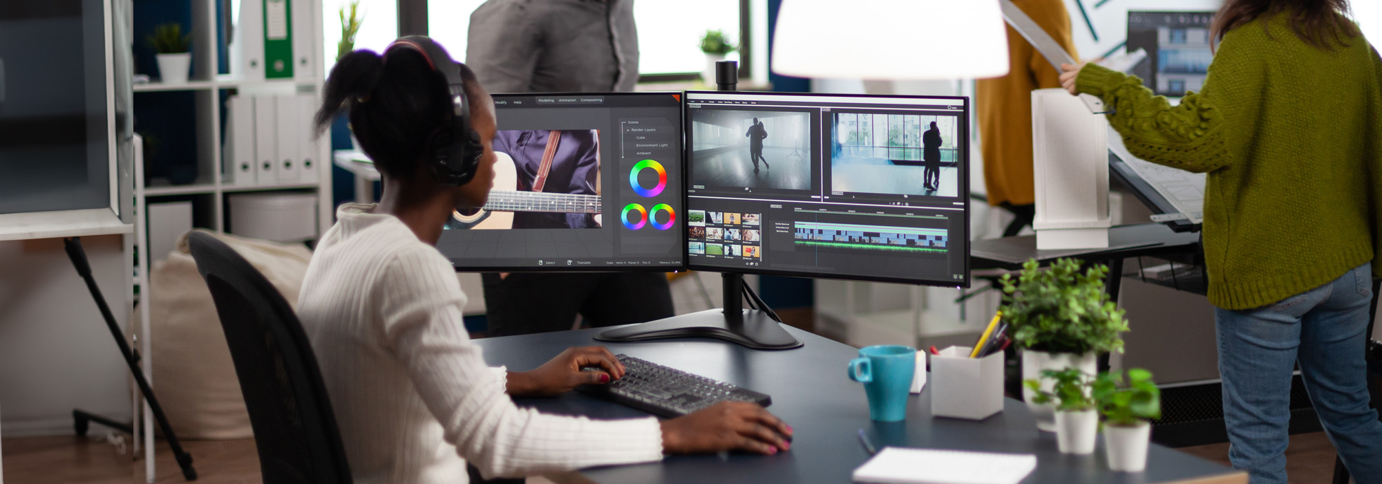 An African American female on the law firm video production team editing footage for a Law Practice