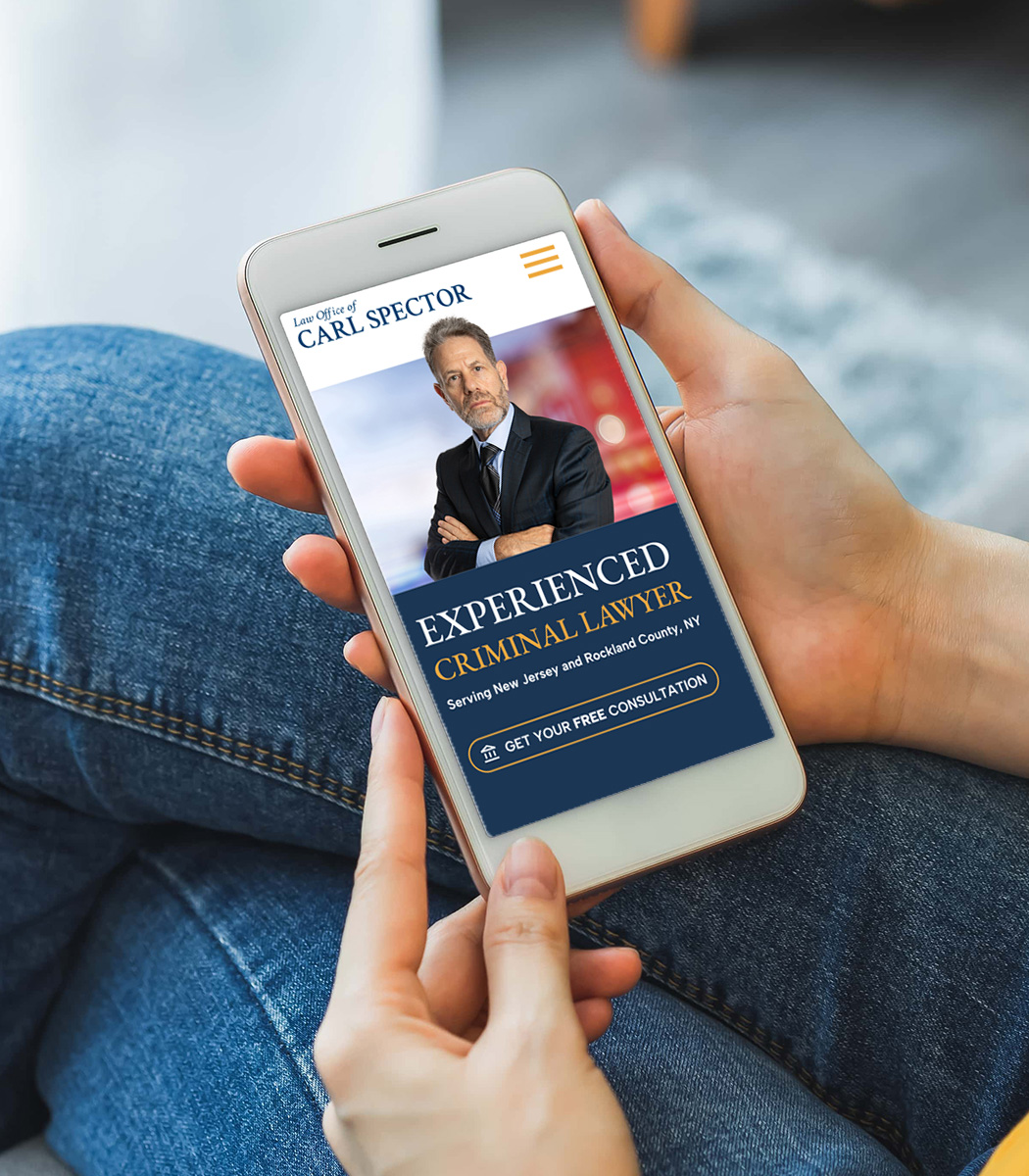 Person holding a smartphone displaying a website for 